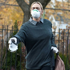 Kate Winslet wearing a mask in the movie Contagion