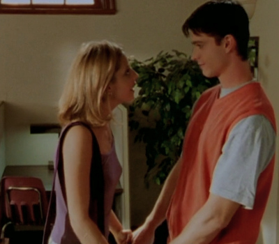 Buffy holding hands with Ford. 