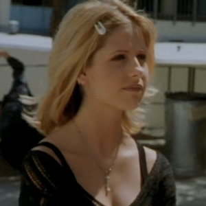 Buffy wearing barrettes on the side of her temple.