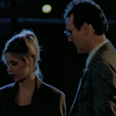 Giles and Buffy looking at Ford's grave