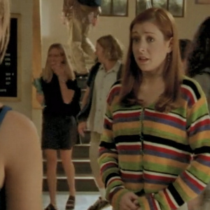 Willow wearing a brightly striped sweater.