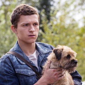 Screenshot from Chaos Walking, with Todd holding his dog Manchee