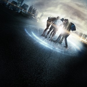 A group of teens huddled together with light swirling around them and a city on the horizon, in a scene from Project Alamanac