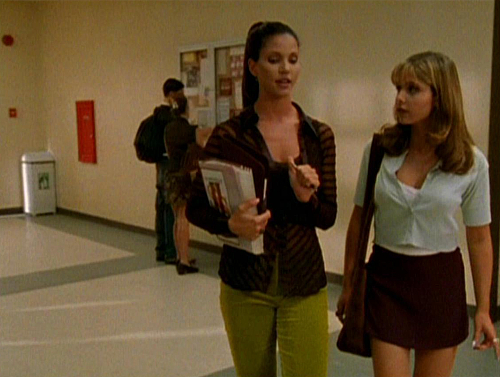 Cordelia wears lime green velvet pants and a sheer black shirt. Buffy wears a maroon mini-skirt and baby blue crop-top in "Welcome to the Hellmouth."