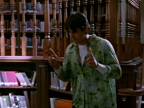 Xander wears a lime-green, button-down shirt printed with mushrooms in "The Harvest"