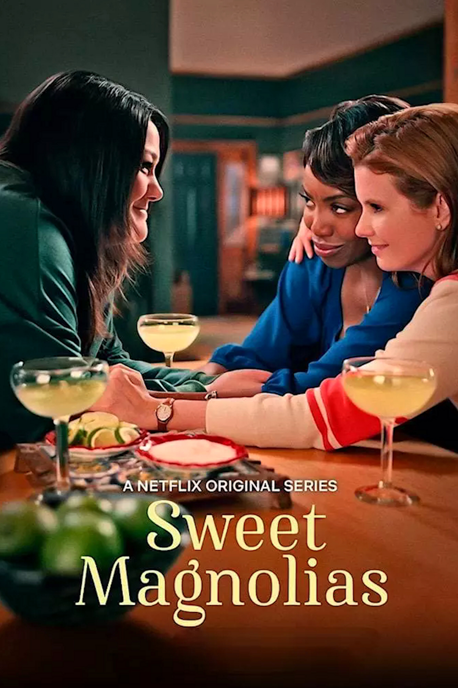 Sweet Magnolias Cover: 3 friends sit around a table drinking margaritas