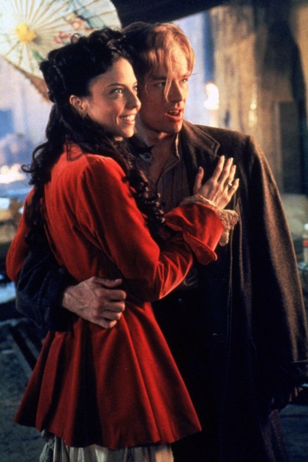 Drusilla and Spike, holding each other while wearing period garb
