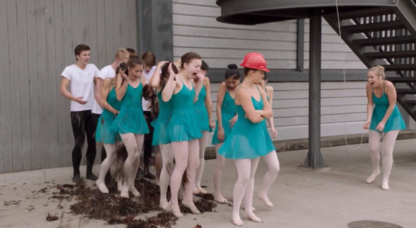 A group of ballet students in shock because they've just had mud dumped on them