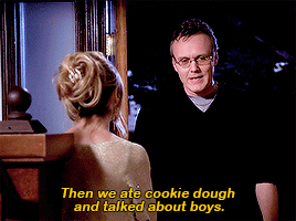 Giles, standing at the front door of the Summers house and talking to Buffy