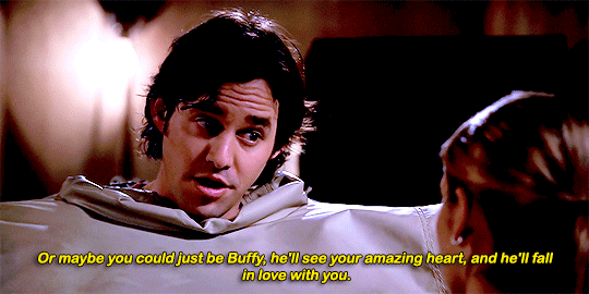 Buffy, talking earnestly to Xander, who is wearing a giant puffy suit to protect him during training
