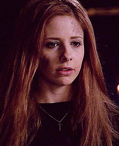 Buffy clenches her face in mental anguish