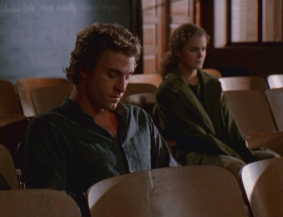 Ben and Felicity, sitting in an empty classroom and looking despondent