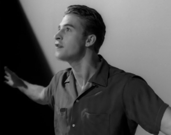  In black and white: Ben, with his hair slicked back, wearing a 50s style short sleeved shirt