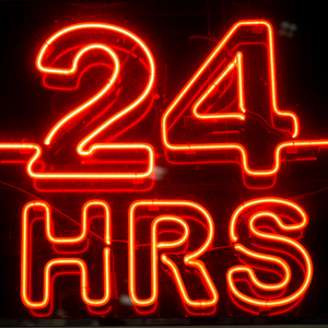 Neon sign that says 24 HRS