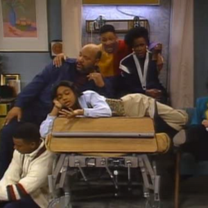 Will hugging Uncle Phil and Aunt Viv in a hospital room, with Ashley sprawled out in front of them and Carlton sitting on the floor