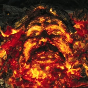 A face made out of fire in a fireplace