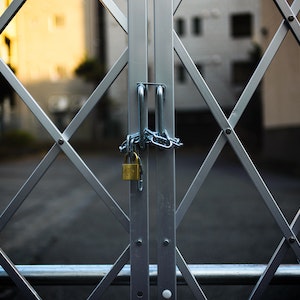 A silver gate locked with a chain