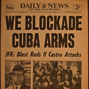 An old newspaper declaring WE BLOCKADE CUBA ARMS