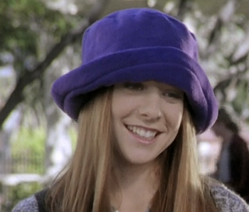 Willow wearing a fuzzy blue hat