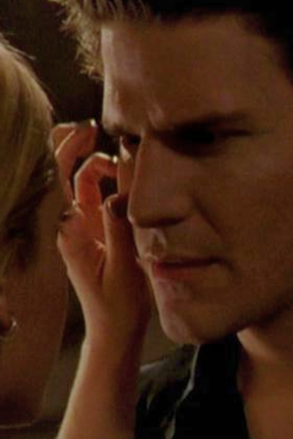 Buffy touches Angel's face