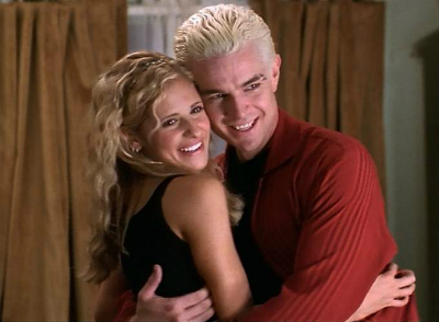 Buffy and Spike embrace while under a spell thinking they're a couple