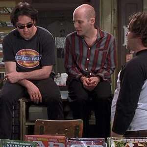 Screenshot from High Fidelity, with the record store staff debating music