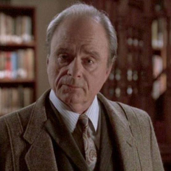 Harris Yulin, a white, older man with silver hair, as Quentin Travers