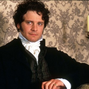 Colin Firth as Mr. Darcy, sitting awkwardly