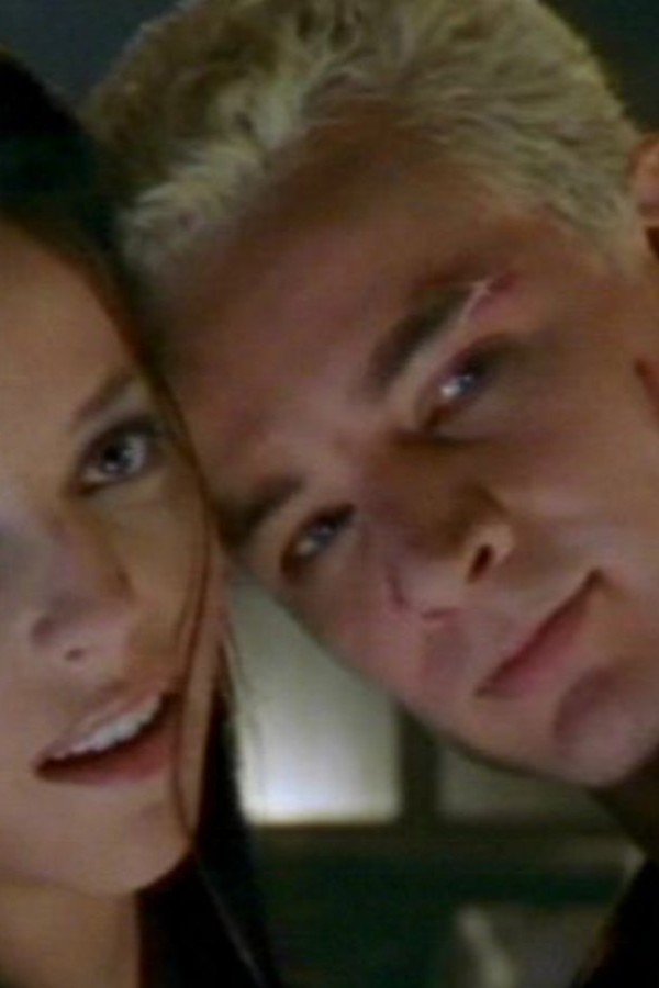 Spike and Drusilla with their faces pressed together