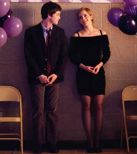 Charlie and Sam, leaning against the wall at a school dance and talking