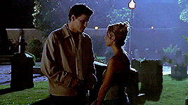 Buffy and Angel, staring into each other's eyes and talking at night in the cemetery