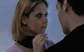 Buffy, stroking Angel's vampire face (with a protruding brow) and then kissing him