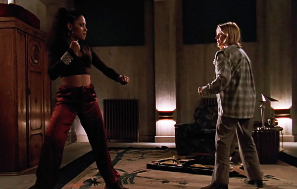 Kendra and Buffy, facing off in fighting stances