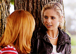 Willow and Buffy talking under a tree and then hugging