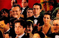 Buffy's classmates applauding her at prom as she stands on stage with her award