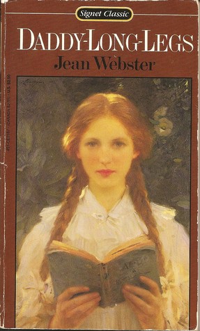 A girl looks at the reader and is holding an open book