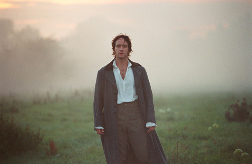 Mr. Darcy, walking through a field rocking a long coat