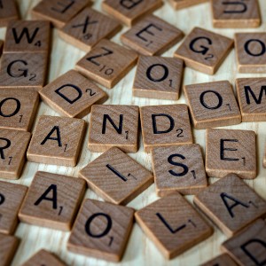 Scrabble wooden letter tiles scattered on a table
