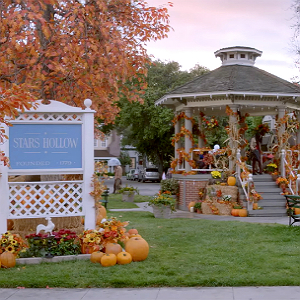 The gazebo and town sign, decorated for a fall festival, in Stars Hollow