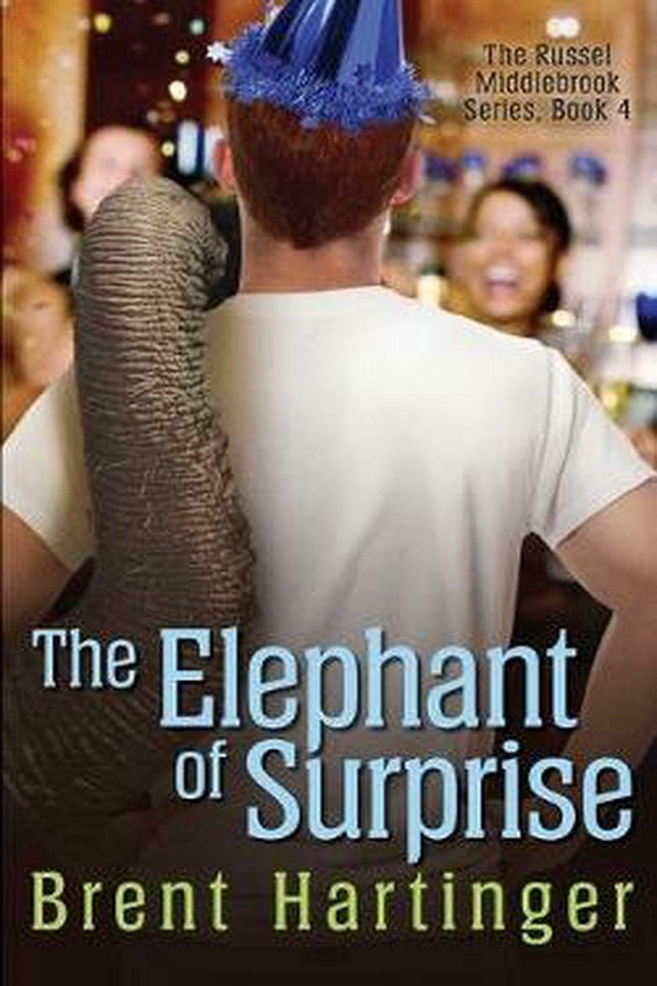 Cover of The Elephant of Surprise by Brent Hartinger. A young man stands with his back to the viewer. He's wearing a party hat and an elephant's trunk is draped over his shoulder.