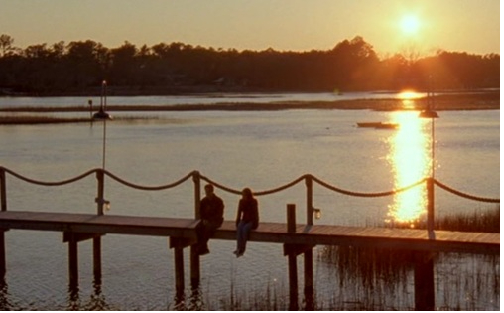 Joey and Dawson sit on the bridge over the creek