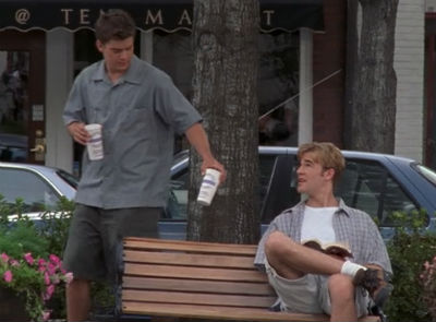 Pacey brings Dawson a coffee. Dawson's in a huge shirt and huge shorts.