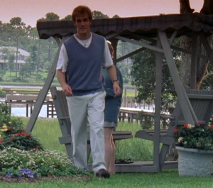 Dawson wears baggy khakis, a baggy sweater vest and baggy white shirt
