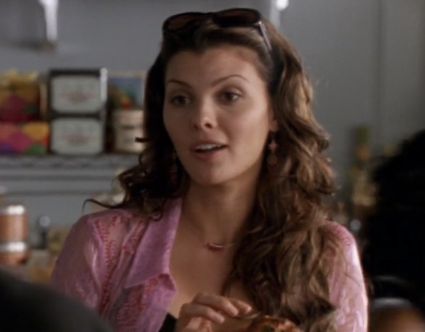 Ali Landry as Natalie, a beautiful brunette with long flowing hair and a spicy expression