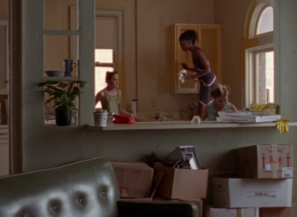 Meghan, Elena, and Julie hanging out in a huge apartment with boxes