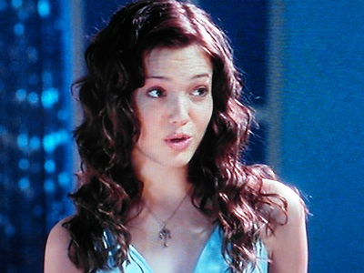 Mandy Moore as Jamie, looking gorgeous with mermaid hair and a silky, light blue sleeveless dress