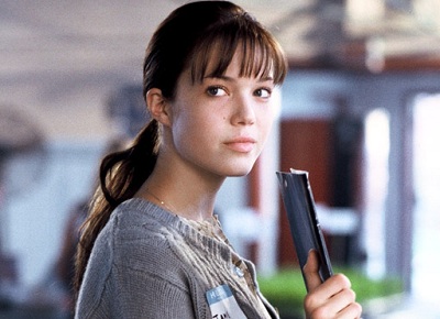 Mandy Moore as Jamie, with her brown hair pulled back and flat, piece-y bangs
