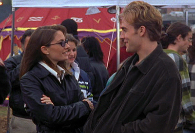 Madchen Amick as Ms. Kennedy stands, in sunglasses, next to a starstruck Dawson