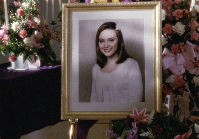 A large, framed photo of Abby is set up at the funeral, surrounded by flowers. In the photo, she looks like a perfect, preppy angel - nothing like the Abby we knew