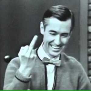 A black and white shot of Mr. Rogers seeming to flip the bird